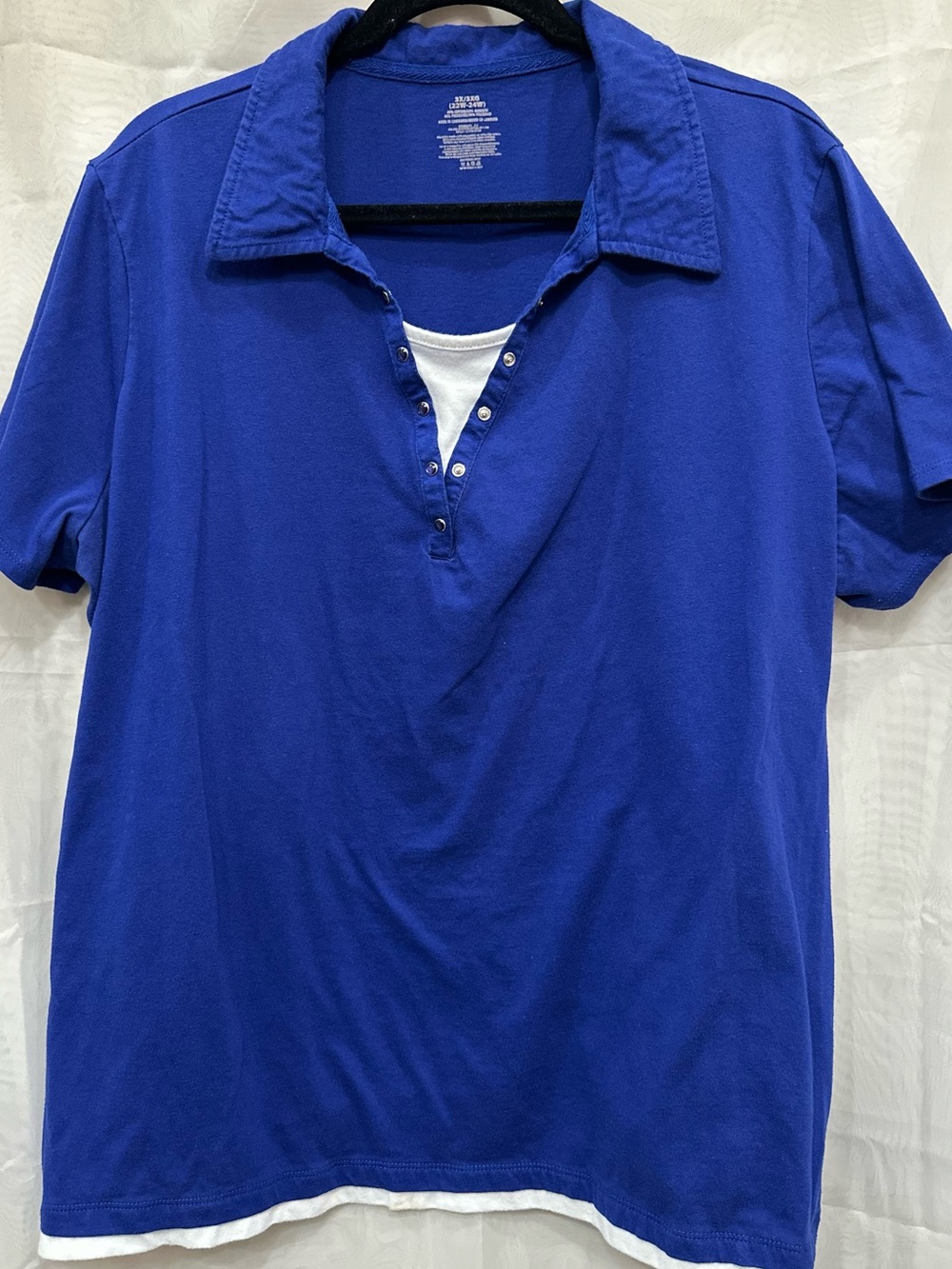 Classic Royal Blue Women's Polo with Decorative Snap Placket and White Accents